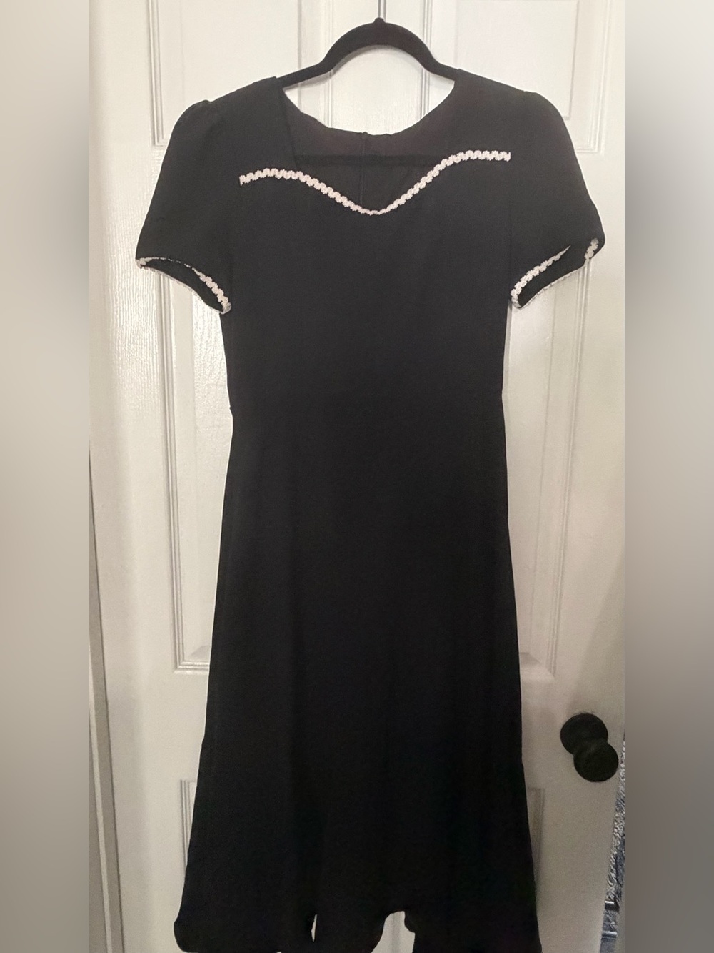 Elegant Black Dress with White Trim